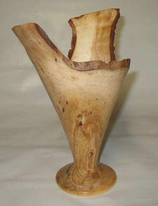finished wood vase rotated one hundred twenty degrees