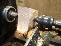 scrap wood block mounted to bowl lathe 