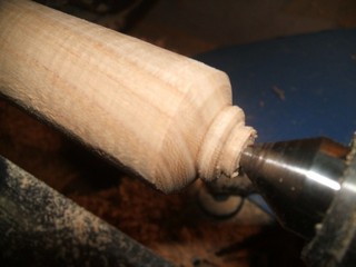 a small bead on the end of the handle