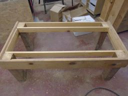 4x4 legs and 1x4 stretchers holding them together   