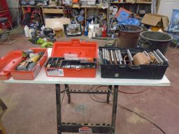 	Three tool boxes for sanding and pens	