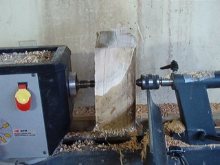 green wood mounted on the lathe for roughing