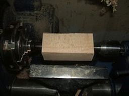 	mount the blank between centers on the lathe.	