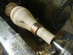 	Flow a smooth cut down the slope of the handle and along the ferrule.	